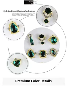 Macro detail of emerald green gemstones with sandblasted gold settings and small zircons
