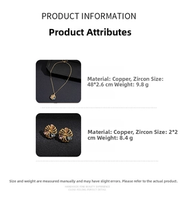 Macro detail of 18K gold plated spiral flower pendant and earrings with zircon inlay