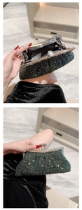 Detail of dark green rhinestone evening clutch showing silver metal clasp and interior