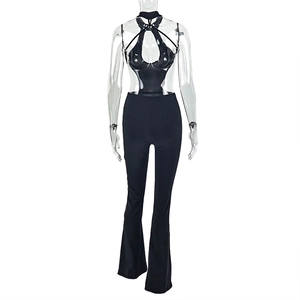 Detail of black halter neck jumpsuit featuring side cutouts and a backless slim fit design
