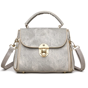 Silver-grey multi-layer crossbody handbag with golden swivel lock and textured finish