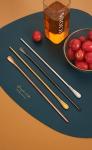 Detailed view of long handle 304 stainless steel spoons in four distinct metallic colors
