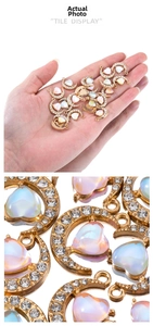 Macro view of 19mm gold alloy moon and iridescent resin heart pendant for DIY jewelry