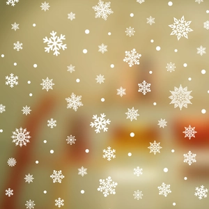 Christmas window decals with white snowflakes and dots on a warm festive background