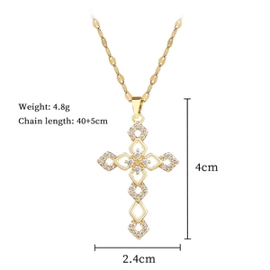 Detailed view of gold cross pendant with dimensions 4cm x 2.4cm and 4.8g weight specs