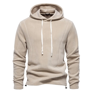 Detailed view of beige polar fleece fabric texture and drawstring on men's sweatshirt