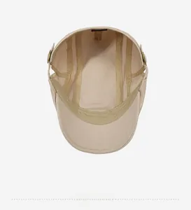 Close-up of 100% cotton inner lining and metal buckle adjustment on the beige beret cap