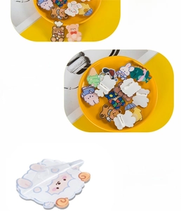 Detailed view of acrylic cartoon badges with pin backs and protective film coating