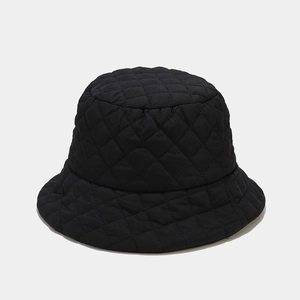 Detailed view of black quilted bucket hat featuring premium diamond stitch texture