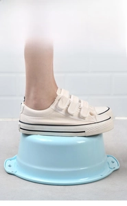 Macro view of light blue plastic washbasin demonstrating durable pressure resistance