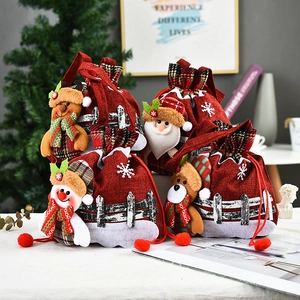 Set of 4 festive Christmas burlap drawstring gift bags with plush 3D Santa and Reindeer dolls