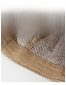 Detail of khaki sports cap interior showing breathable mesh and wide SPORT sweatband