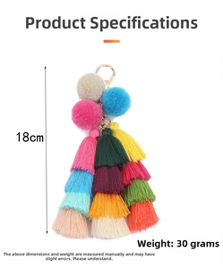 Detailed view of bohemian tassel keychain with colorful pom-poms and size dimensions