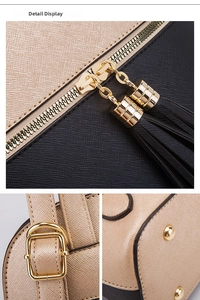 Detail view of cross-grain leather backpack with gold zippers and tassel accents