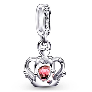 Polished silver crown charm pendant featuring a large pink gemstone and clear crystals