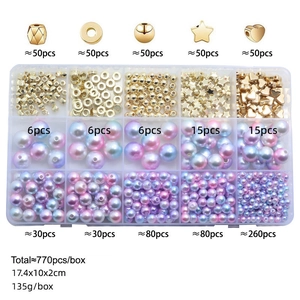 Macro detail of DIY 770pcs jewelry kit with ABS pearls and gold beads in storage box
