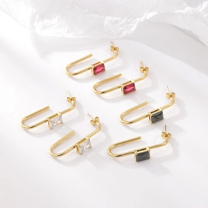 Three pairs of gold plated J-shaped earrings with red, white and black zircon stones