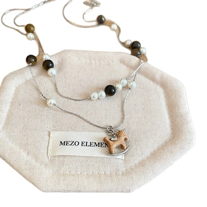 Double-layered tiger eye and pearl necklace with a vintage rocking horse pendant