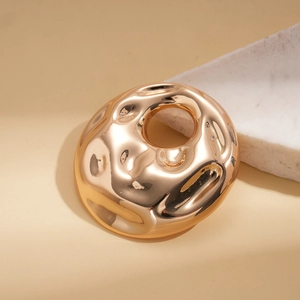 Elegant gold round brooch with irregular vintage wavy texture and high polished mirror finish