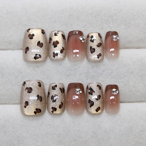 Brown leopard print press-on nails with cat eye glitter and sparkling rhinestones