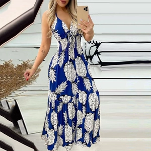 Detail of blue high-waisted maxi dress with white pineapple print and V-neckline ties