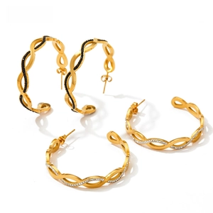 Detail of twisted C-shaped earrings with black and white zirconia inlay craftsmanship