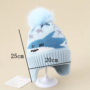 Detailed knit texture of light blue shark pattern earflap hat with dimensions 25x20cm
