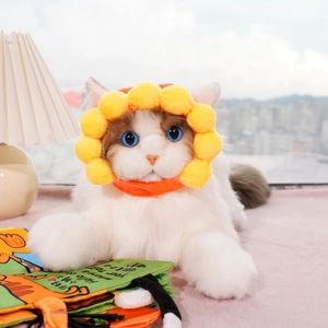 Close-up of cat sunflower plush headpiece with vibrant yellow petals and soft fabric