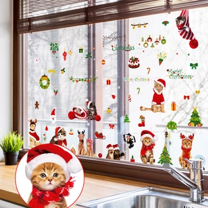 Christmas window static clings featuring festive cats and trees on kitchen glass