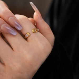 Detail shot of a vintage gold-plated teardrop ring with sparkling cubic zirconia inlay