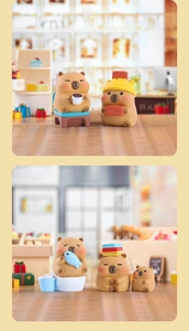 Macro scene of miniature capybara figures in resin with coffee and hat decorations