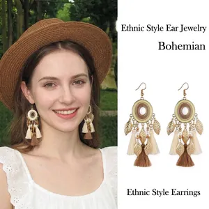 Bohemian retro ethnic style drop earrings with leaf pendants and cotton tassels