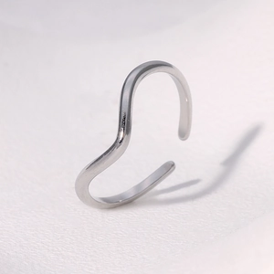 Macro shot of silver S925 sterling silver wavy open ring with hallmark detail