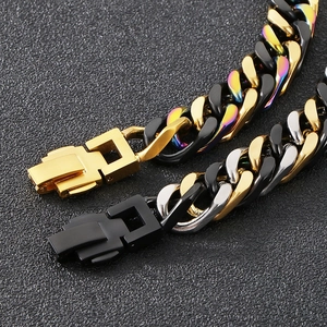 Close-up of rainbow and silver cuban link bracelets with polished metal texture