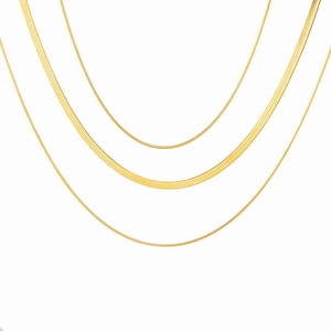 Three assorted gold-plated stainless steel chains including herringbone and snake chain styles