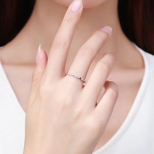 Minimalist s925 silver heart ring for women with black and clear gemstones on a model