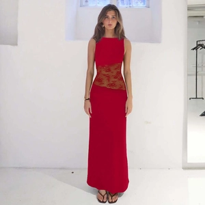 Detail of red sleeveless lace dress showing the see-through waist patchwork and texture