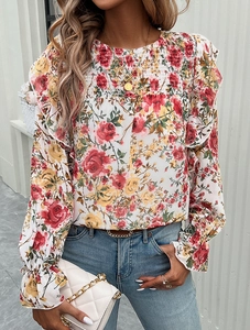 Detailed view of the floral print pattern and smocked chest design on this long sleeve blouse