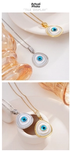 Detail showing 18K gold and silver teardrop Evil Eye pendants with zircon accents