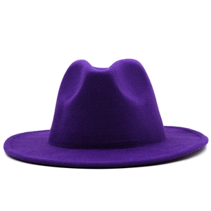 Elegant deep purple felt fedora hat with a wide flat brim and classic wool crown style