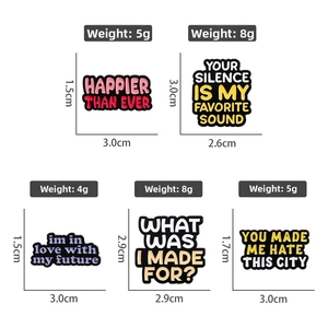 Assorted colorful enamel pins with inspirational quotes and size specifications