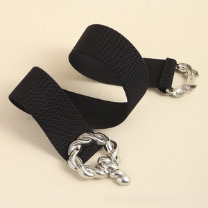 Detail of black elastic waist belt with a silver interlocking rope knot buckle
