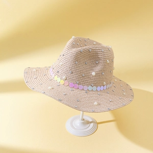 Women's straw sun hat with pearls and sequins for stylish outdoor sun protection