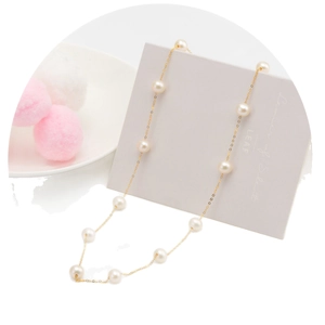 Elegant S925 silver necklace featuring evenly spaced white freshwater pearls on a gold chain