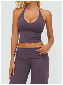 Detail of deep purple brushed yoga set with V-neck halter top and high-waist leggings