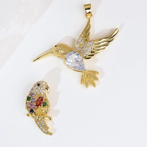 Gold bird pendants with hummingbird and parrot motifs set with colorful zircon stones