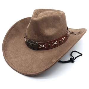 Detail of suede western cowboy hat featuring a leather band and metal bull head ornament