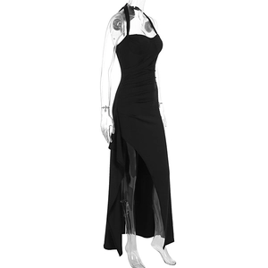 Detail view of black halter evening dress showing side ruching and sexy high side slit