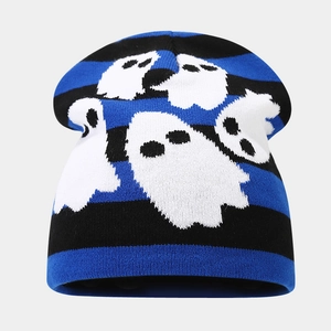 Detail of blue and black striped Halloween beanie with knitted white ghost patterns
