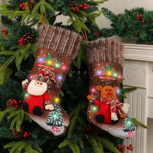 LED Christmas stockings set with Santa and Reindeer plush figures for home festive decor